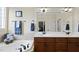 Bright bathroom with a soaking tub, double sink vanity with marble countertops, and neutral tiling at 512 Hallburg Ct, Wake Forest, NC 27587