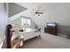 Cozy bedroom featuring a ceiling fan, television, and dormer window with natural light at 512 Hallburg Ct, Wake Forest, NC 27587