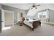 Bright bedroom featuring carpet flooring, a dormer window, and a ceiling fan with a light at 512 Hallburg Ct, Wake Forest, NC 27587