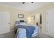 Cozy bedroom with blue accents, soft lighting, and an ensuite bathroom at 512 Hallburg Ct, Wake Forest, NC 27587