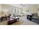 Spacious bedroom with natural light, multiple beds, and a cozy seating area, perfect for relaxation at 512 Hallburg Ct, Wake Forest, NC 27587