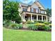 Charming two-story home with a welcoming front porch and beautifully landscaped front yard at 512 Hallburg Ct, Wake Forest, NC 27587