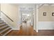 Bright foyer featuring hardwood floors, white trim, and view into the living room, creating a welcoming entry at 512 Hallburg Ct, Wake Forest, NC 27587