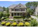 Charming two-story home with a welcoming front porch and beautiful landscaping at 512 Hallburg Ct, Wake Forest, NC 27587