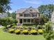 Beautiful two-story home with a charming front porch and professionally landscaped front yard at 512 Hallburg Ct, Wake Forest, NC 27587