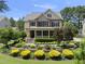 Attractive two-story home featuring a covered front porch and meticulously maintained landscaping at 512 Hallburg Ct, Wake Forest, NC 27587