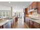 Open concept kitchen with stainless steel appliances and a view to the sunroom at 512 Hallburg Ct, Wake Forest, NC 27587