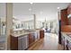 Open concept kitchen with stainless steel appliances, granite countertops, and eat-in bar at 512 Hallburg Ct, Wake Forest, NC 27587