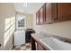 Functional laundry room features modern washer and dryer, ample cabinetry, and a practical sink at 512 Hallburg Ct, Wake Forest, NC 27587