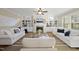 Spacious living room with fireplace, built-in bookshelves, and comfortable white sofas at 512 Hallburg Ct, Wake Forest, NC 27587