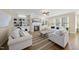 Cozy living room with built-in shelves, fireplace, and large windows, offering a comfortable space at 512 Hallburg Ct, Wake Forest, NC 27587