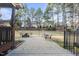 Outdoor patio with brick pavers, mature trees, and a backyard view at 512 Hallburg Ct, Wake Forest, NC 27587