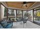 Relaxing screened porch with a dining table and cozy cushioned seating at 512 Hallburg Ct, Wake Forest, NC 27587