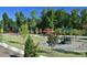 Community playground with slides, swings, and climbing structures set in a well-maintained green space at 512 Hallburg Ct, Wake Forest, NC 27587
