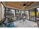 Relaxing screened-in porch with outdoor seating, a ceiling fan, and views of the backyard at 512 Hallburg Ct, Wake Forest, NC 27587