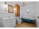 Cozy bathroom with a clawfoot tub, classic vanity, and vintage-inspired fixtures for a relaxing retreat at 529 Hillcrest Ave, Burlington, NC 27215