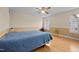 Comfortable bedroom with hardwood floors, neutral color palette and natural light at 529 Hillcrest Ave, Burlington, NC 27215