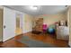 Bedroom features hardwood floors, natural light, and a doorway leading to another room at 529 Hillcrest Ave, Burlington, NC 27215