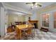 Sunlit dining room with checkerboard floors, a fireplace, and easy access to another dining area at 529 Hillcrest Ave, Burlington, NC 27215