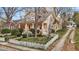 Charming two-story home with a front porch, landscaped yard, and a classic white picket fence at 529 Hillcrest Ave, Burlington, NC 27215