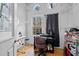 Cozy home office featuring hardwood floors, white trim, natural light, and built in shelving at 529 Hillcrest Ave, Burlington, NC 27215