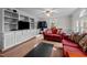 Spacious living room featuring hardwood floors, built-in shelving, and comfortable seating, ideal for gatherings at 529 Hillcrest Ave, Burlington, NC 27215