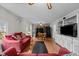 The living room features hardwood floors, cozy seating, and built in cabinets at 529 Hillcrest Ave, Burlington, NC 27215