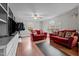 The living room features hardwood floors, cozy seating, and ample natural light at 529 Hillcrest Ave, Burlington, NC 27215