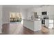 Bright kitchen with stainless steel appliances, granite counters, and backyard view at 5320 River Reach Dr, Raleigh, NC 27616
