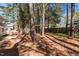 Private backyard showcasing mature trees, a wooded area, and a serene outdoor space at 5812 Timber Ridge Dr, Raleigh, NC 27609