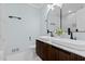 Modern bathroom features double sinks with sleek black fixtures and marble countertops at 5812 Timber Ridge Dr, Raleigh, NC 27609
