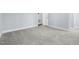 Cozy bedroom featuring soft carpet, neutral paint, and a doorway at 5812 Timber Ridge Dr, Raleigh, NC 27609