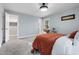 Cozy bedroom with light blue walls, neutral carpet, and stylish decor at 5812 Timber Ridge Dr, Raleigh, NC 27609