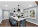 Spacious kitchen with marble countertops, island with seating, and stainless steel appliances at 5812 Timber Ridge Dr, Raleigh, NC 27609