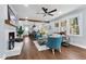 Inviting living room featuring a fireplace, wood beam accent, and an open layout at 5812 Timber Ridge Dr, Raleigh, NC 27609