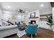 Comfortable living room with a fireplace, built-ins, and stylish seating area at 5812 Timber Ridge Dr, Raleigh, NC 27609