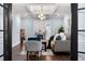 Open-concept living room with modern decor, hardwood floors, and stylish accents at 5812 Timber Ridge Dr, Raleigh, NC 27609