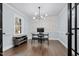 Modern office space with geometric wallpaper, sleek desk, and ample natural light at 5812 Timber Ridge Dr, Raleigh, NC 27609