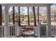 Charming neighborhood street view from a classic front porch with white railings at 5812 Timber Ridge Dr, Raleigh, NC 27609
