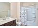 Full bathroom with shower-tub combo, brown vanity, and neutral color scheme at 590 Grand Central Sta, Apex, NC 27502