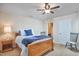 Bright bedroom features neutral walls, ceiling fan, and wood furniture; an ensuite bathroom is nearby at 590 Grand Central Sta, Apex, NC 27502