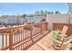 Spacious wooden deck area with two chairs overlooking the neighborhood, ideal for relaxation and outdoor enjoyment at 590 Grand Central Sta, Apex, NC 27502