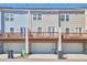 Exterior view of townhomes showing decks above garages at 590 Grand Central Sta, Apex, NC 27502