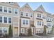 Beautiful townhome exteriors showcasing varied siding, architectural details, and well-maintained landscaping at 590 Grand Central Sta, Apex, NC 27502