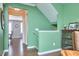 Open hallway design with hardwood floors and neutral paint. Doorways lead into the dining and living areas at 590 Grand Central Sta, Apex, NC 27502