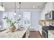 Stylish kitchen featuring granite countertops, stainless steel appliances, and a large island with a sink at 590 Grand Central Sta, Apex, NC 27502