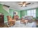 Inviting living room with a cozy fireplace, stylish furniture, and abundant natural light from the windows at 590 Grand Central Sta, Apex, NC 27502