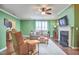 Inviting living room with a cozy fireplace, stylish furniture, and abundant natural light from the windows at 590 Grand Central Sta, Apex, NC 27502