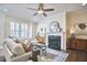 Serene living room featuring a fireplace, neutral color palette, and stylish furnishings creating an inviting atmosphere at 590 Grand Central Sta, Apex, NC 27502