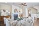 Inviting living room with fireplace, chic furniture, and open flow to dining area ideal for gatherings and relaxation at 590 Grand Central Sta, Apex, NC 27502